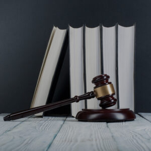 Law,Concept,-,Open,Law,Book,With,A,Wooden,Judges