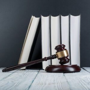 Law,Concept,-,Open,Law,Book,With,A,Wooden,Judges